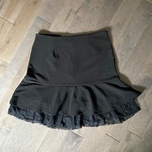 Super cute Black Tape brand size Small skirt with back zip and lace bottom.